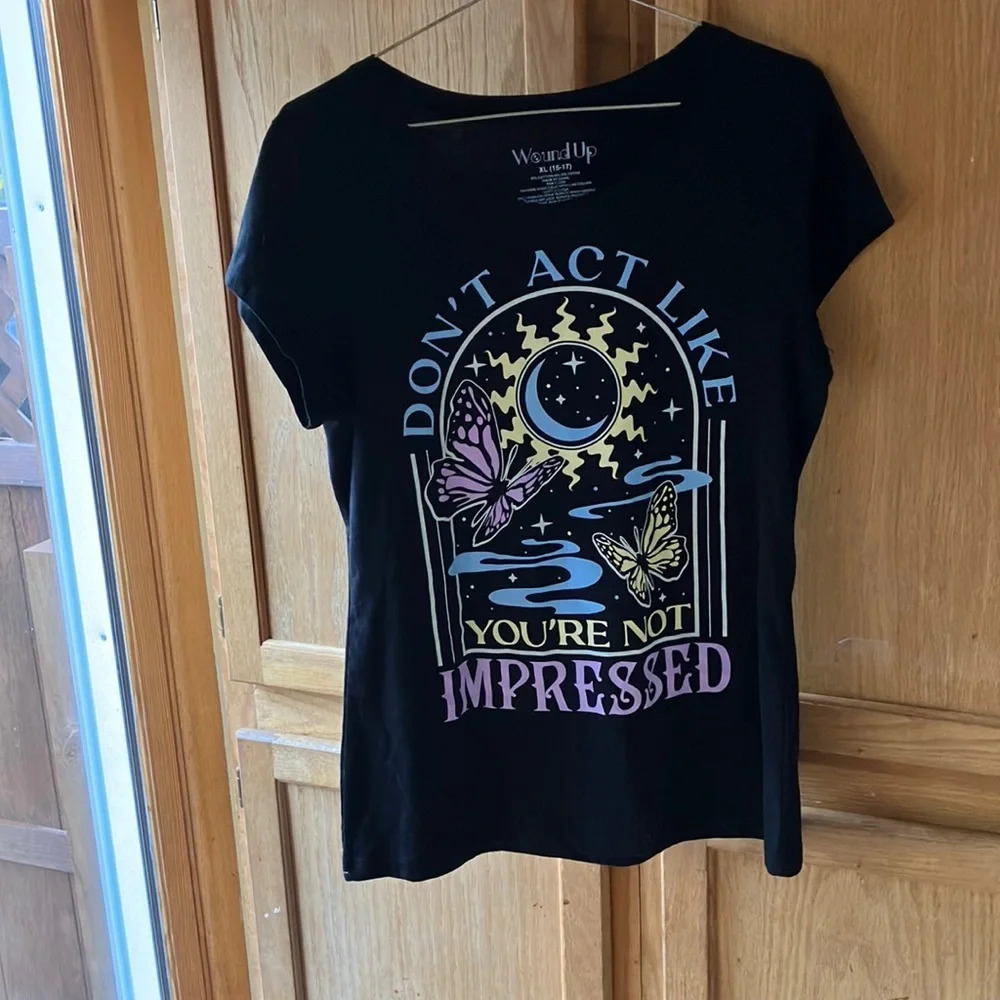 Wound Up graphic tee shirt XL (15-17) Design shows off on the black background.